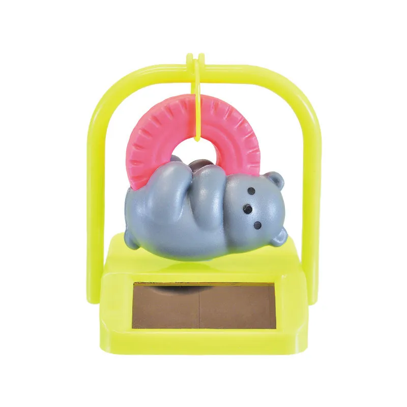 X 70834 SOLAR SWINGING BEAR  CAPSULE-DISCONTINUED